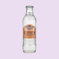 A glass bottle of Franklin & Sons Rosemary & Black Olive Tonic Water, a premium mixer.