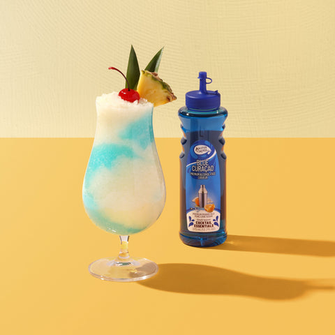 A slush cocktail made with Master of mixes cocktail essentials blue curacao, perfect for making cocktails and mocktails. 
