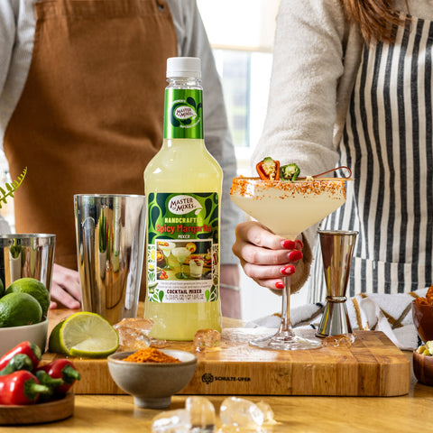 People making a spicy margarita using Master of Mixes spicy margarita mixer, a perfect bar ingredient for cocktails or mocktails. 
