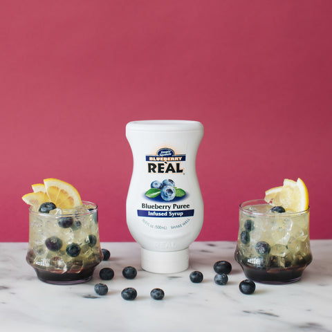 Two drinks made with blueberry Real syrup. 