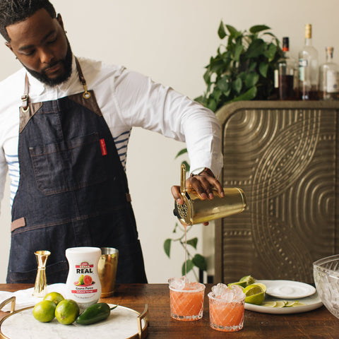 Someone making cocktails using Real guava syrup, Real syrups are gluten-free and vegan and are the perfect cocktail or mocktail ingredient. 