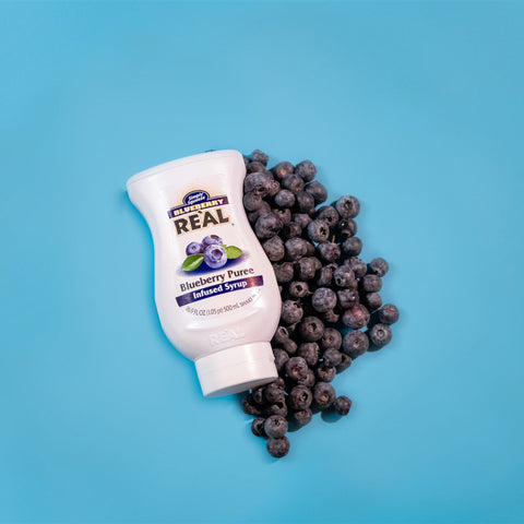 A bottle of Real blueberry puree syrup,  Real syrups are perfect for cooking & baking, making cocktails or mocktails and dirty sodas. 