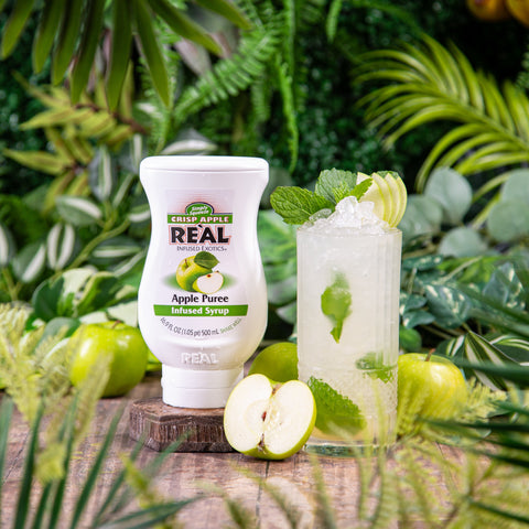 Reál apple puree infused syrup, next to a cocktail made with the syrup.