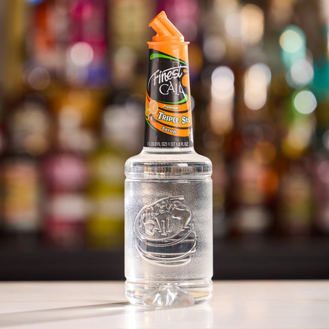 A bottle of Finest Call premium triple sec syrup, the perfect cocktail or mocktail ingredient. 