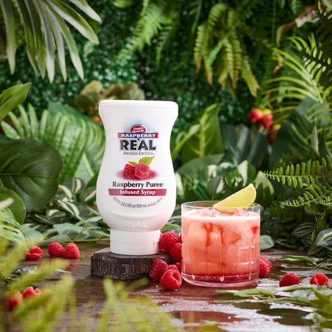 A raspberry cocktail made using Reál raspberry puree syrup, a vegan and gluten free syrup that's perfect for making cocktails or mocktails, cooking & baking or making dirty sodas.