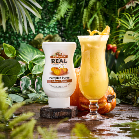 Real pumpkin puree syrup next to a pumpkin cocktail, Real syrups are perfect for cooking & baking, making cocktails or mocktails and dirty sodas. 