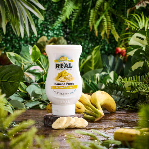 A bottle of Real banana puree syrup, a perfect syrup to use for cocktails or mocktails, cooking and baking or making milkshakes. 