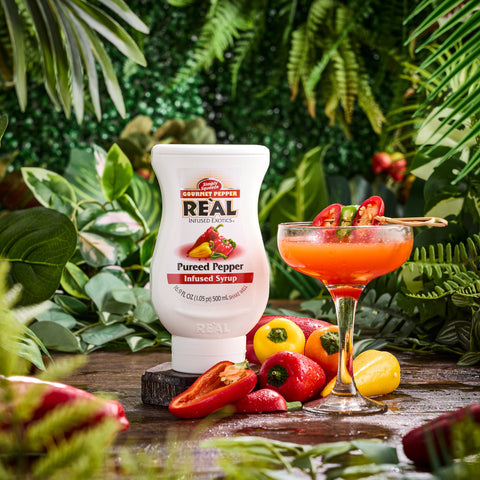 Real gourmet pepper infused syrup next to a chilli cocktail that has been made using Real, Real syrups are perfect for cooking & baking, making cocktails or mocktails and dirty sodas. 