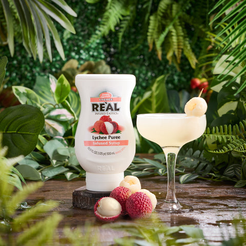 A lychee cocktail made using Real lychee puree syrup, a vegan and glute-free syrup that is a perfect cocktail ingredient. 