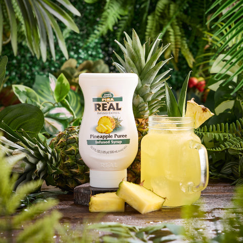 A pineapple cocktail made using Real pineapple puree syrup, a vegan and gluten-free syrup that is the perfect cocktail or mocktail ingredient.