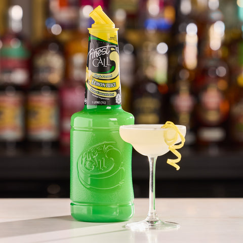 Finest Call Lemon Juice on a bar with a serve