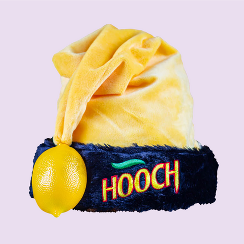 Hooch branded yellow Santa Hat with a lemon attachment for the top of that hat, featuring a fur trim and an embroidered 'Hooch' logo.