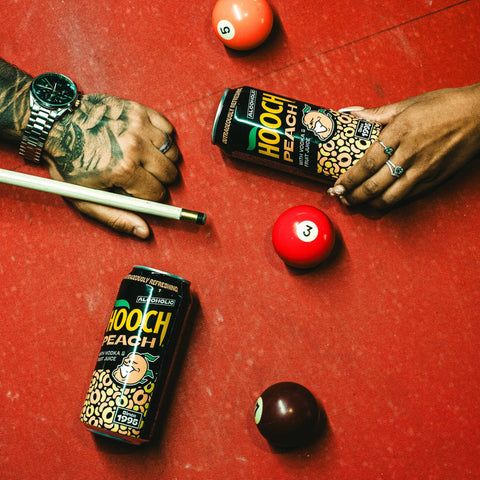 Two cans of Hooch Peach, a premixed and ready to drink alcopop made with vodka and fruit juice. 