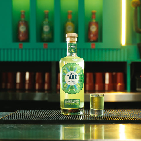 A bottle of Take jalapeno tequila liqueur, perfect for making cocktails or having easy shots. 