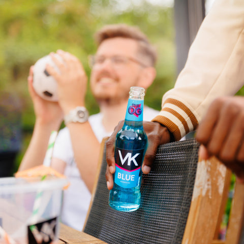 Someone drinking VK blue vodka mix, ready to drink alcopop. 