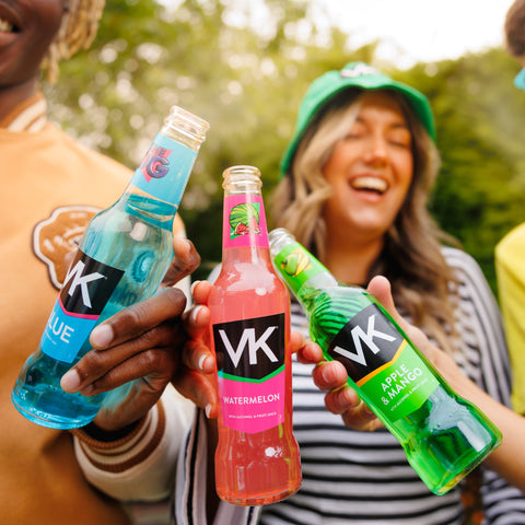 People holding and drinking VK vodka mix, ready to drink alcopop. 