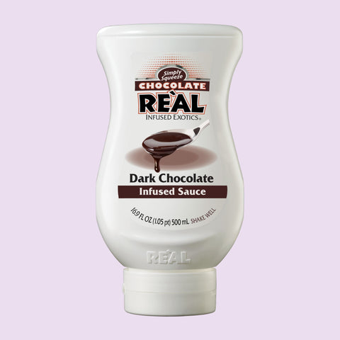 A 500ml bottle of Reál Dark Chocolate Infused Sauce, perfect for making coffee, hot chocolate, matcha, cocktails and baking. 