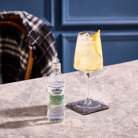 A gin and tonic using Franklin & Sons elderflower & cucumber tonic water as a premium mixer. 