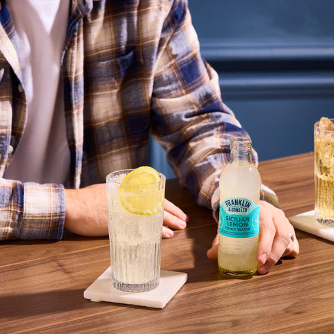 Someone using Franklin & Sons Sicilian lemon tonic water as a premium mixer. 