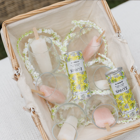 Cans of All Shook Up Elderflower, Mint & Lime white wine spritz, these are premixed, ready to drink canned cocktails.