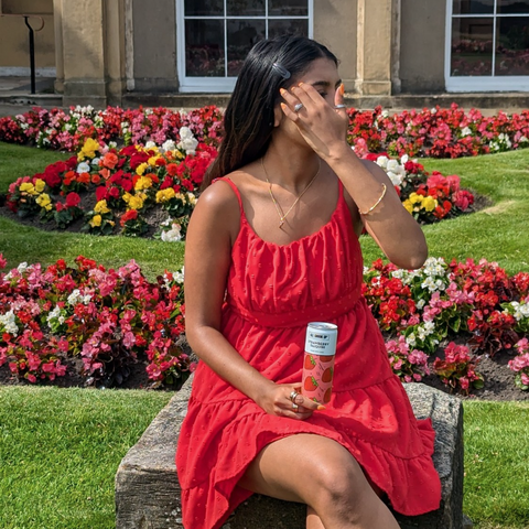 Someone drinking All Shook Up strawberry daiquiri premixed, ready to drink canned cocktail.