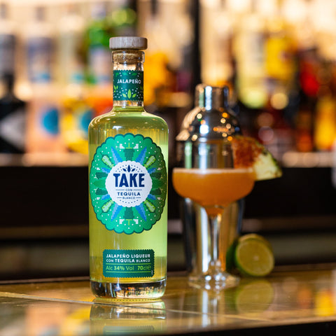 Bottle of Take jalapeno liqueur, the perfect drink for making cocktails or having easy shots.