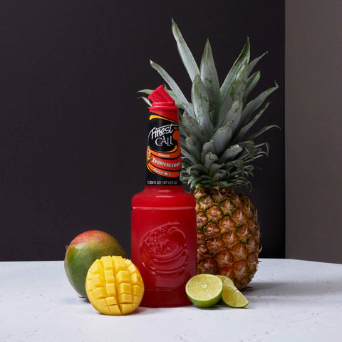 A bottle of Finest Call Premium Tropical fruit puree mix, perfect for mixing cocktails, mocktails and sodas. 