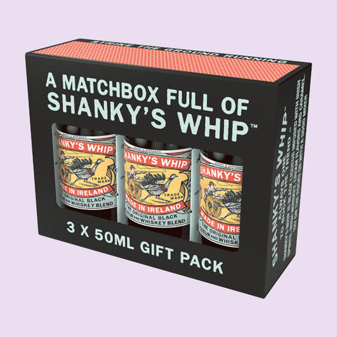 A black matchbox packaging containing three bottles of Shanky's Whip liqueur, each labelled 50ml, a smooth, Irish liqueur and whiskey blend. 