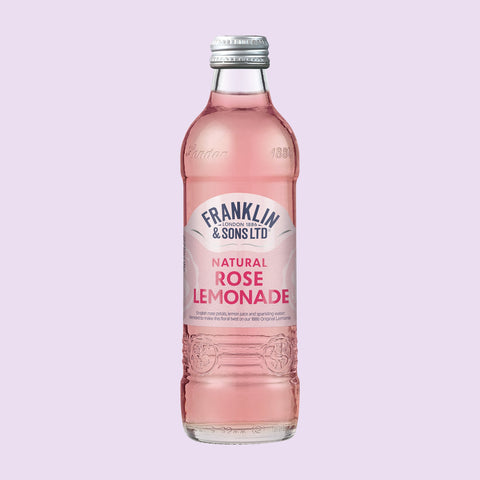 Bottle of Franklin & Sons Natural Rose Lemonade on a light purple background