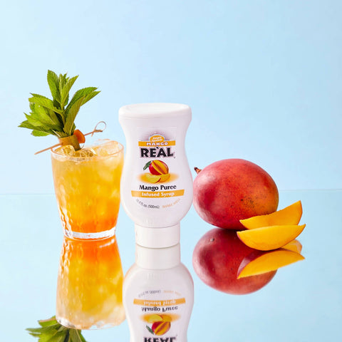 Real Mango Puree bottle featured in image with drink