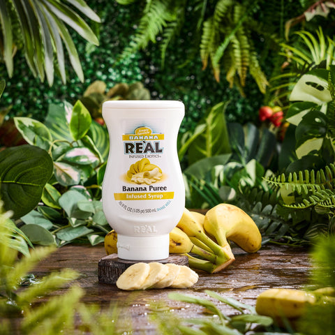 A bottle of Real banana puree syrup, a perfect syrup to use for cocktails or mocktails, cooking and baking or making milkshakes. 