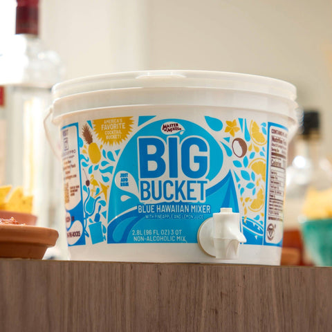 Master of Mixes Big Bucket Blue Hawaiian Mixer on a table. 