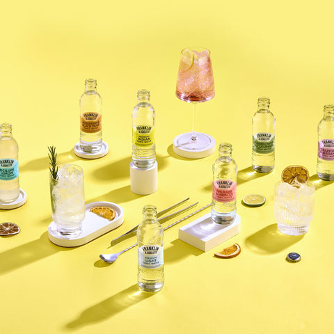 Different bottles of Franklin & Sons premium tonics with glasses of Franklin & Sons being used as a mixer. 