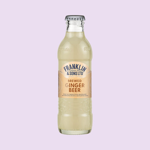A bottle of Franklin & Sons brewed ginger beer, a premium soft drink. 
