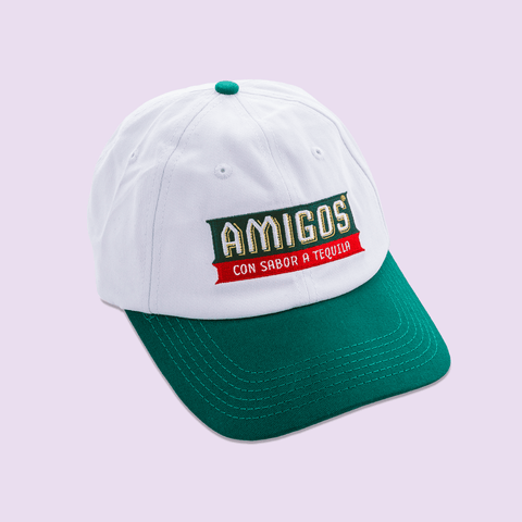 White and green Amigos cap, Amigos is a tequila flavoured beer and this hat is the merch for this brand. 