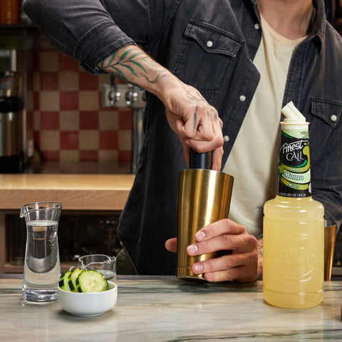 Finest Call Mojito Mixer being used to make a mojito cocktail at a bar
