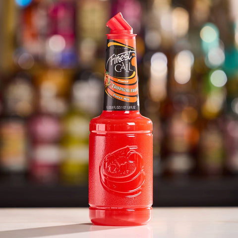 A bottle of Finest Call Premium Tropical fruit puree mix, perfect for mixing cocktails, mocktails and sodas. 