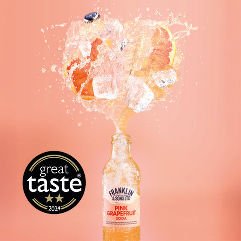 A bottle of Franklin & Sons Pink Grapefruit soda, the perfect soft drink or mixer, with a great taste 2024 badge. 