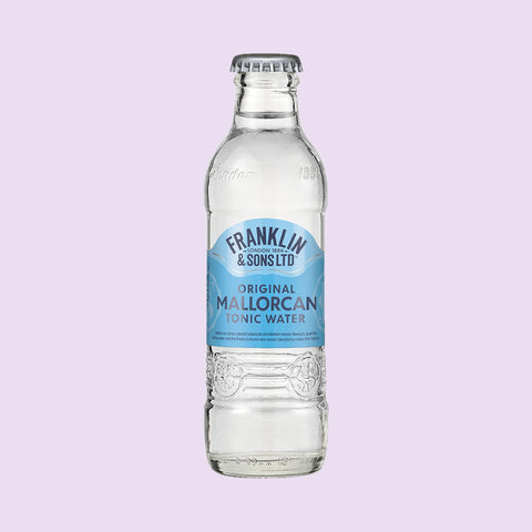 A glass bottle of Franklin & Sons Original Mallorcan Tonic Water, a premium tonic water. 
