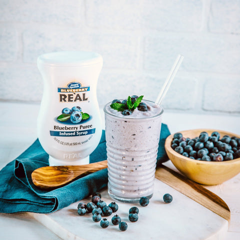 A blueberry milkshake made with Real blueberry puree syrup, a gluten-free and vegan syrup. 