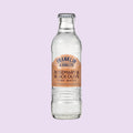 A glass bottle of Franklin & Sons Rosemary & Black Olive Tonic Water, a premium mixer. 