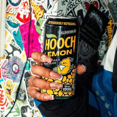 Someone holding a can of Lemon Hooch, a premixed alcoholic lemonade. 