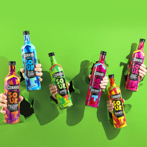 Bottles of Corky's sour schnapps coming through a green background. Corky's is perfect for easy shots and cocktails. 