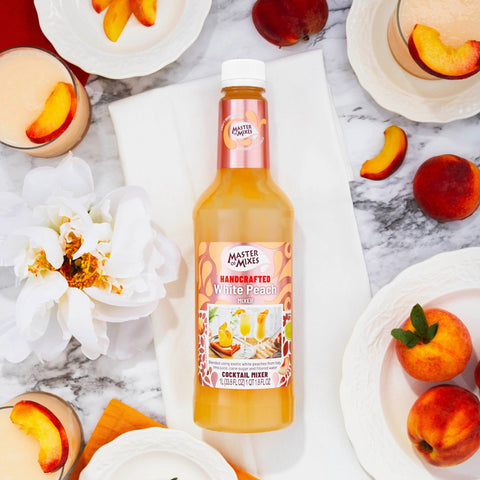A bottle of Master of Mixes White Peach cocktail mixer, a non-alcoholic cocktail and mocktail mixer. 