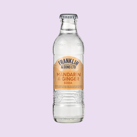 A bottle of Franklin & Sons Mandarin & Ginger Soda, a premium soft drink. 