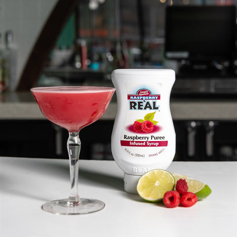 A raspberry cocktail made using Reál raspberry puree syrup, Reál syrups are perfect for cooking & baking, making cocktails or mocktails and dirty sodas. 