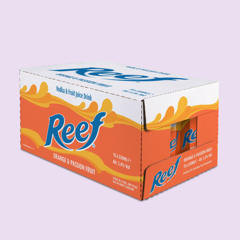 Box of Reef orange and passion fruit juice drink on a light purple background