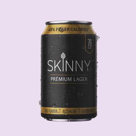 Skinny Premium Lager can on a light purple background