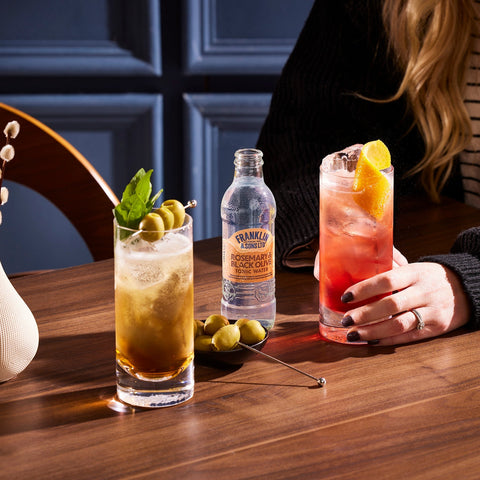 Two cocktails made using Franklin & Sons rosemary & black olive tonic water, a premium mixer.