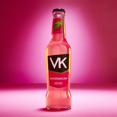 A bottle of VK Watermelon, a ready-to-drink alcoholic beverage with a pink label and watermelon design, against a pink background.